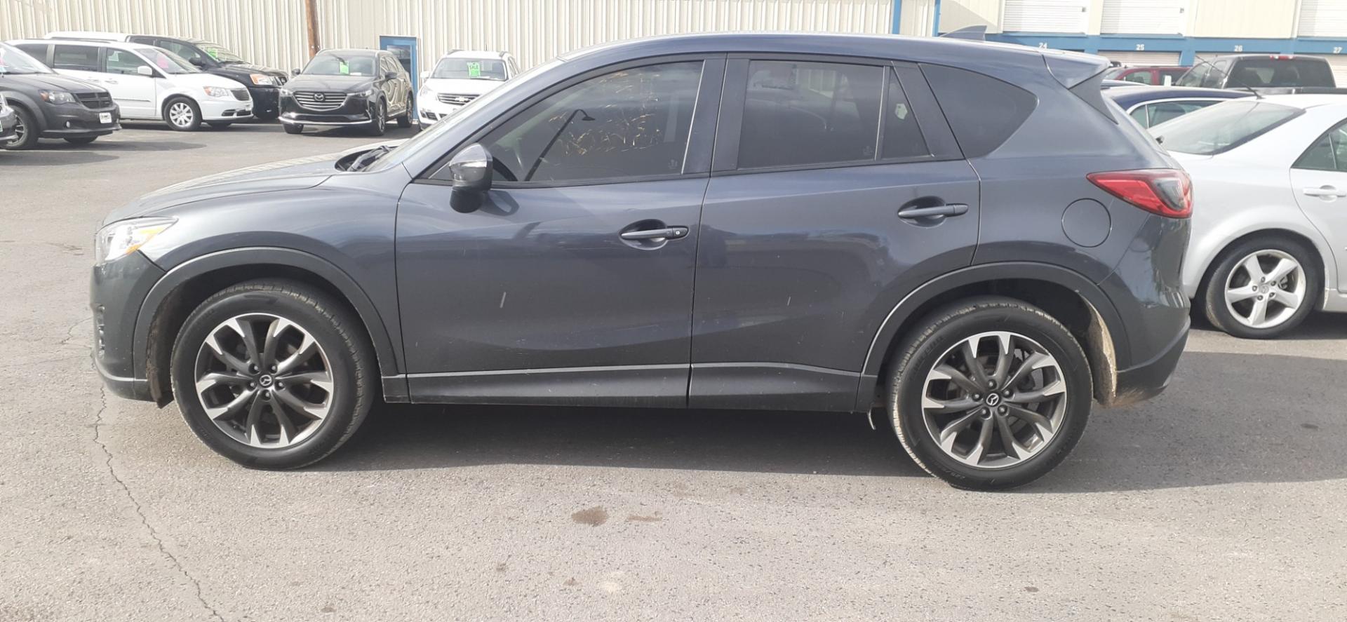 2016 Mazda CX-5 (JM3KE4DY5G0) , located at 2015 Cambell Street, Rapid City, SD, 57701, (605) 342-8326, 44.066433, -103.191772 - CARFAX AVAILABLE - Photo#0